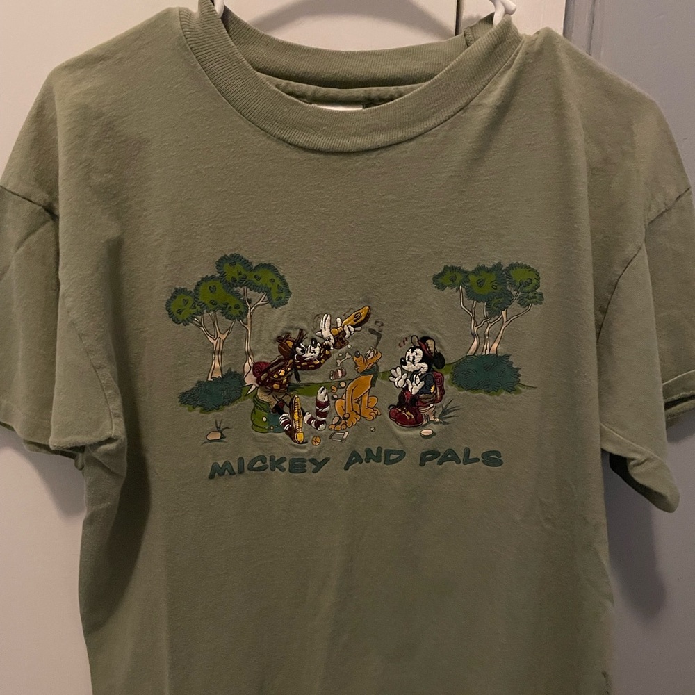 Olive green size large, fits more like a medium. Mickey and pals embroidery.
